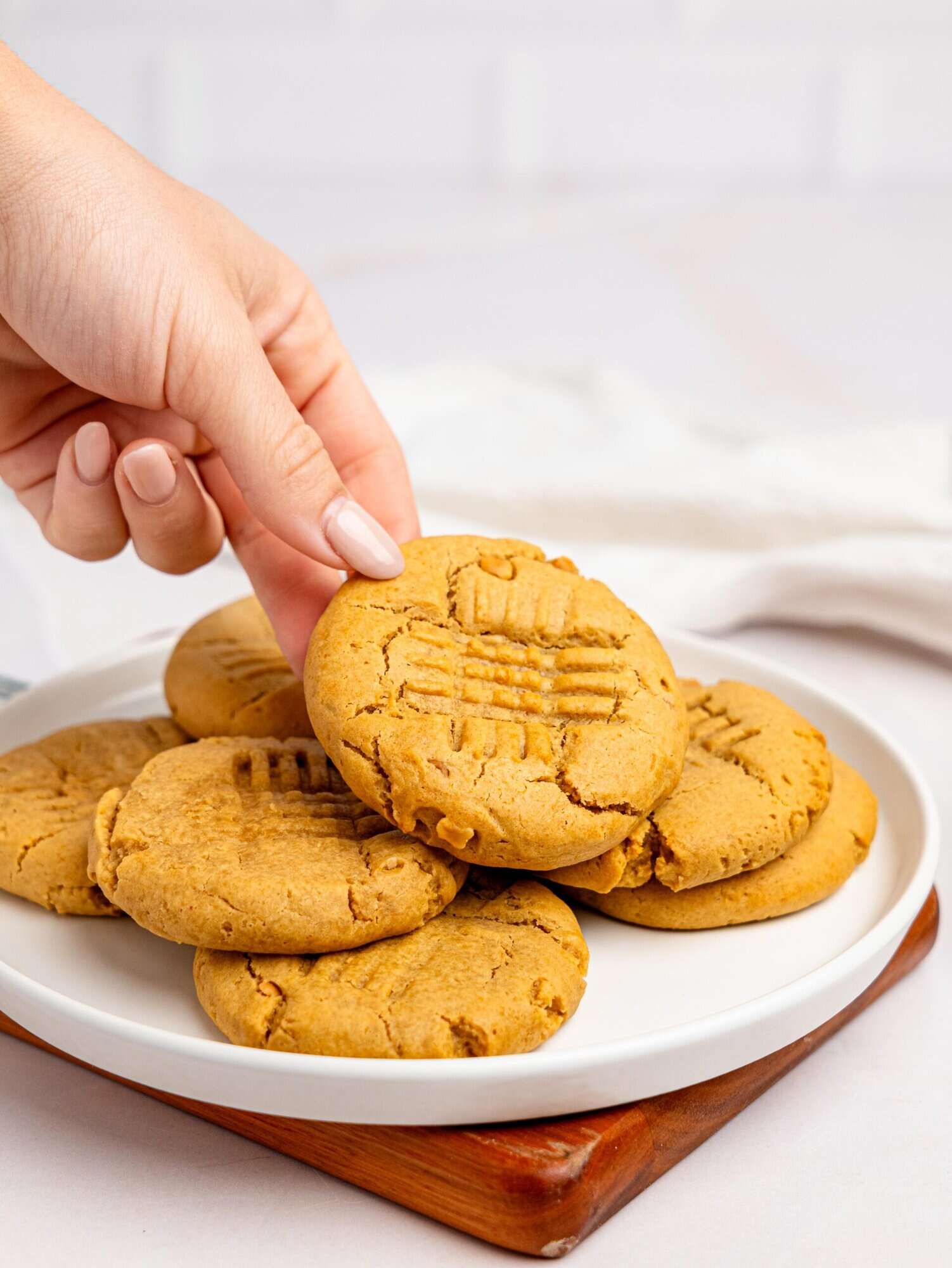 Peanut butter cookies no butter on a white plate.