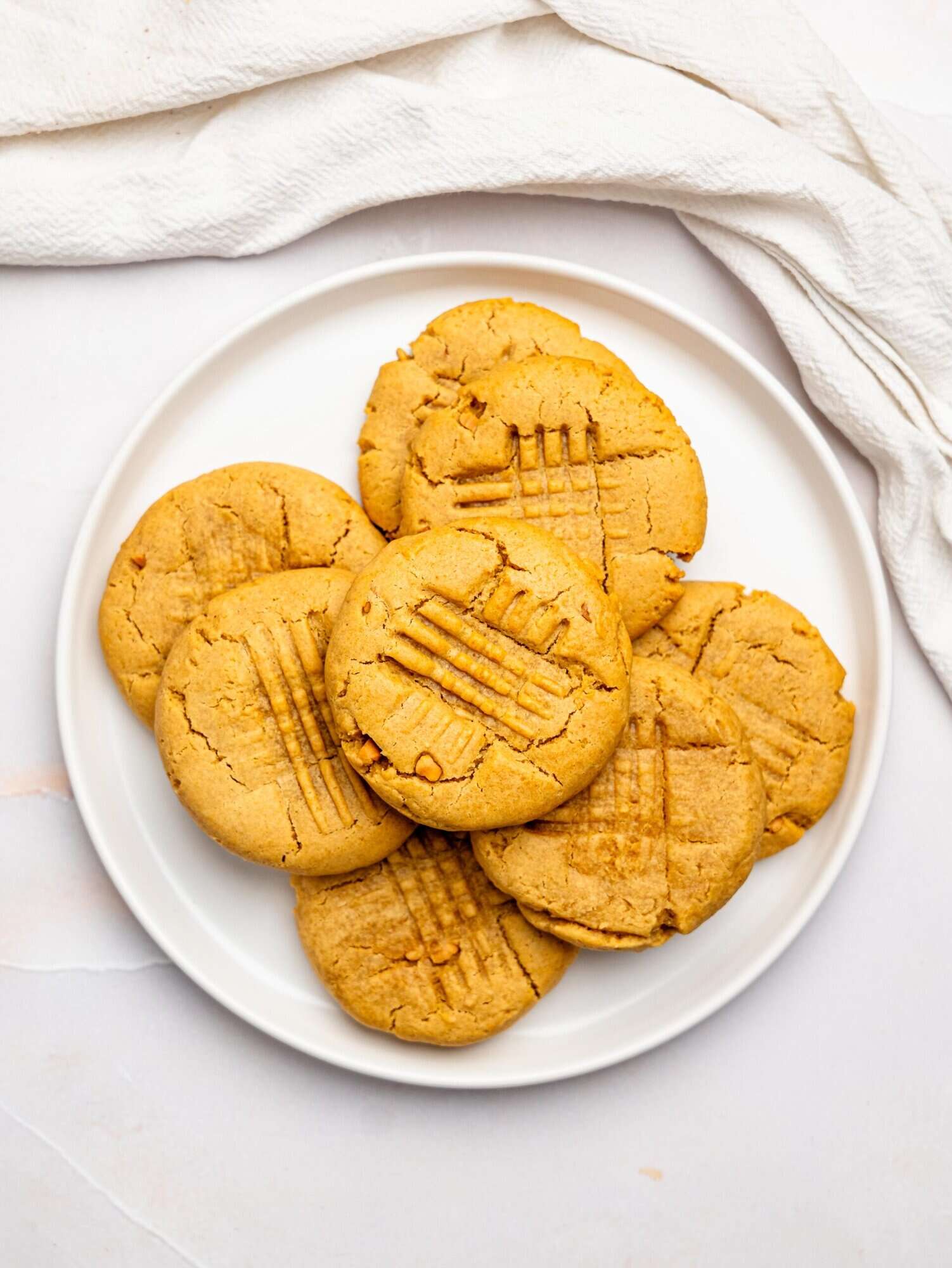 Peanut butter cookies no butter on a white plate.