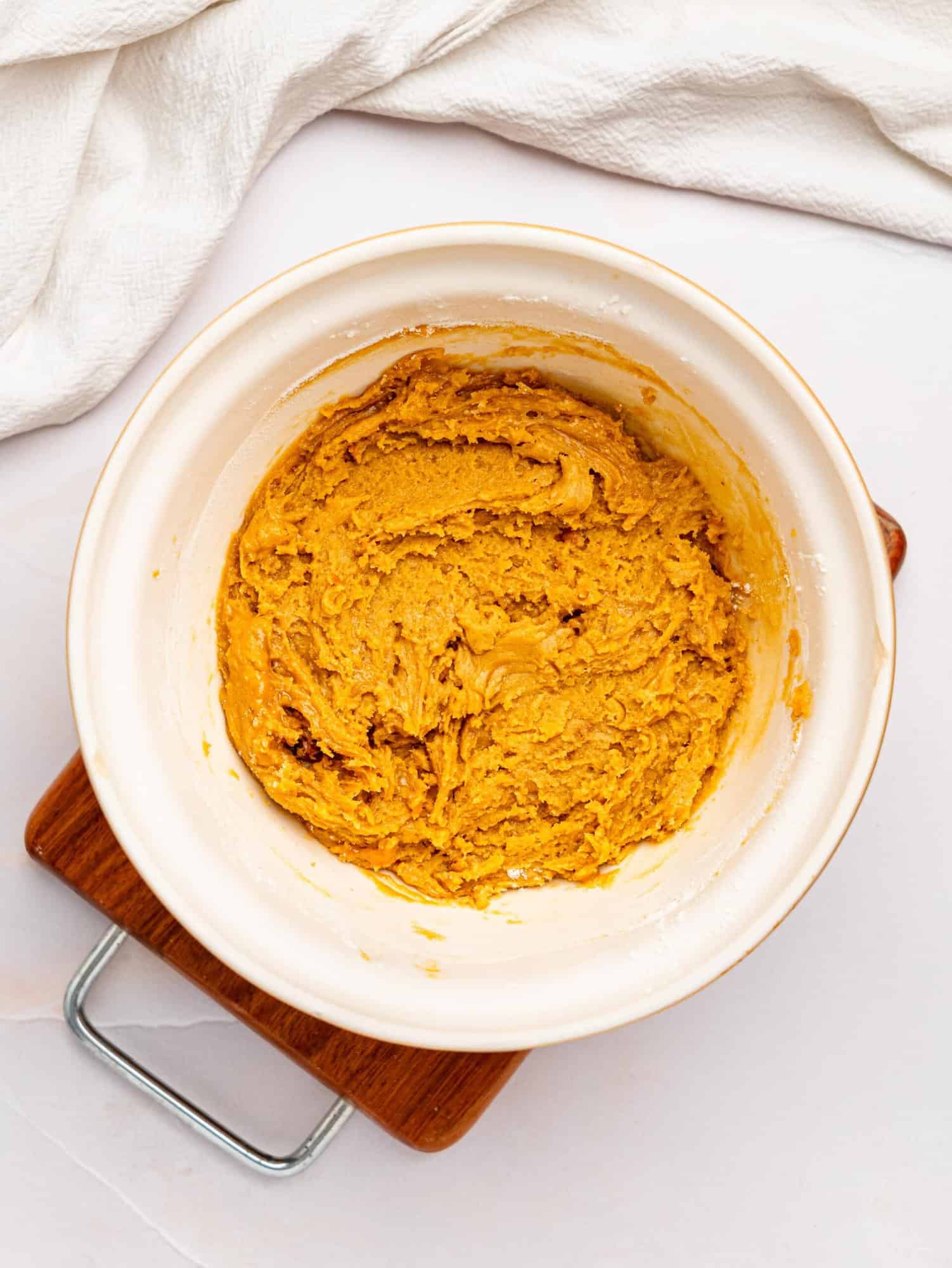 Healthy peanut butter cookie batter in a mixing bowl.