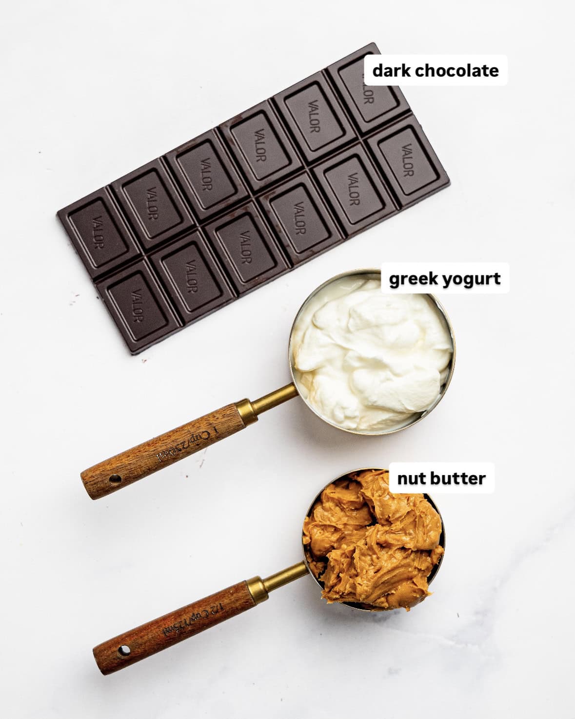 Ingredients needed to make healthier 3 ingredient fudge: dark chocolate, Greek yogurt, and nut butter.