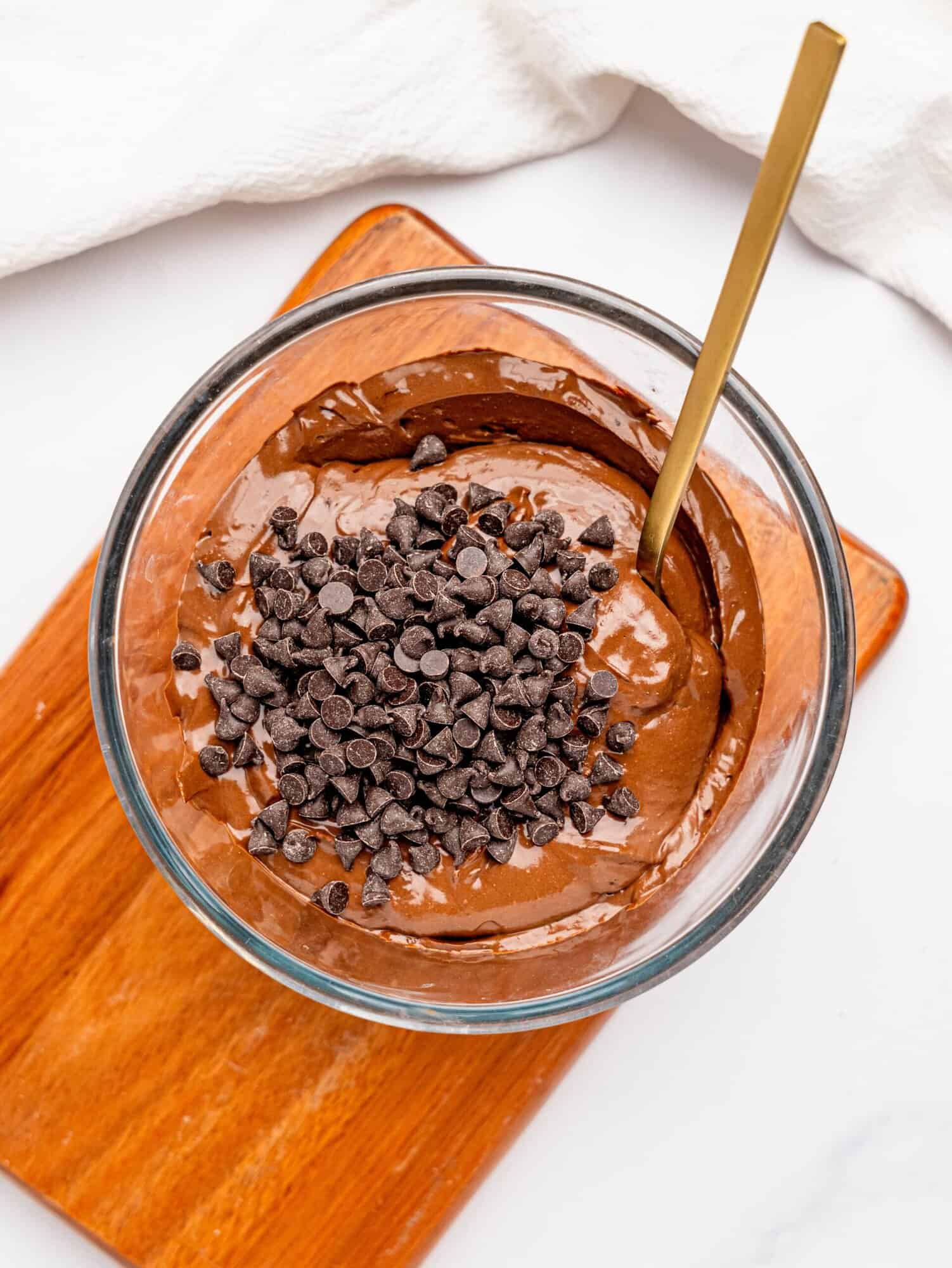 Cottage cheese chocolate mousse with chocolate chips in a glass bowl.