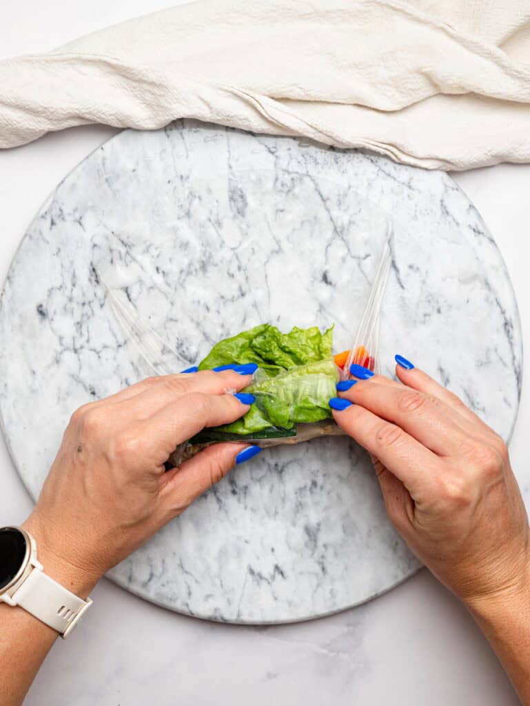 Rolling a chicken summer roll.