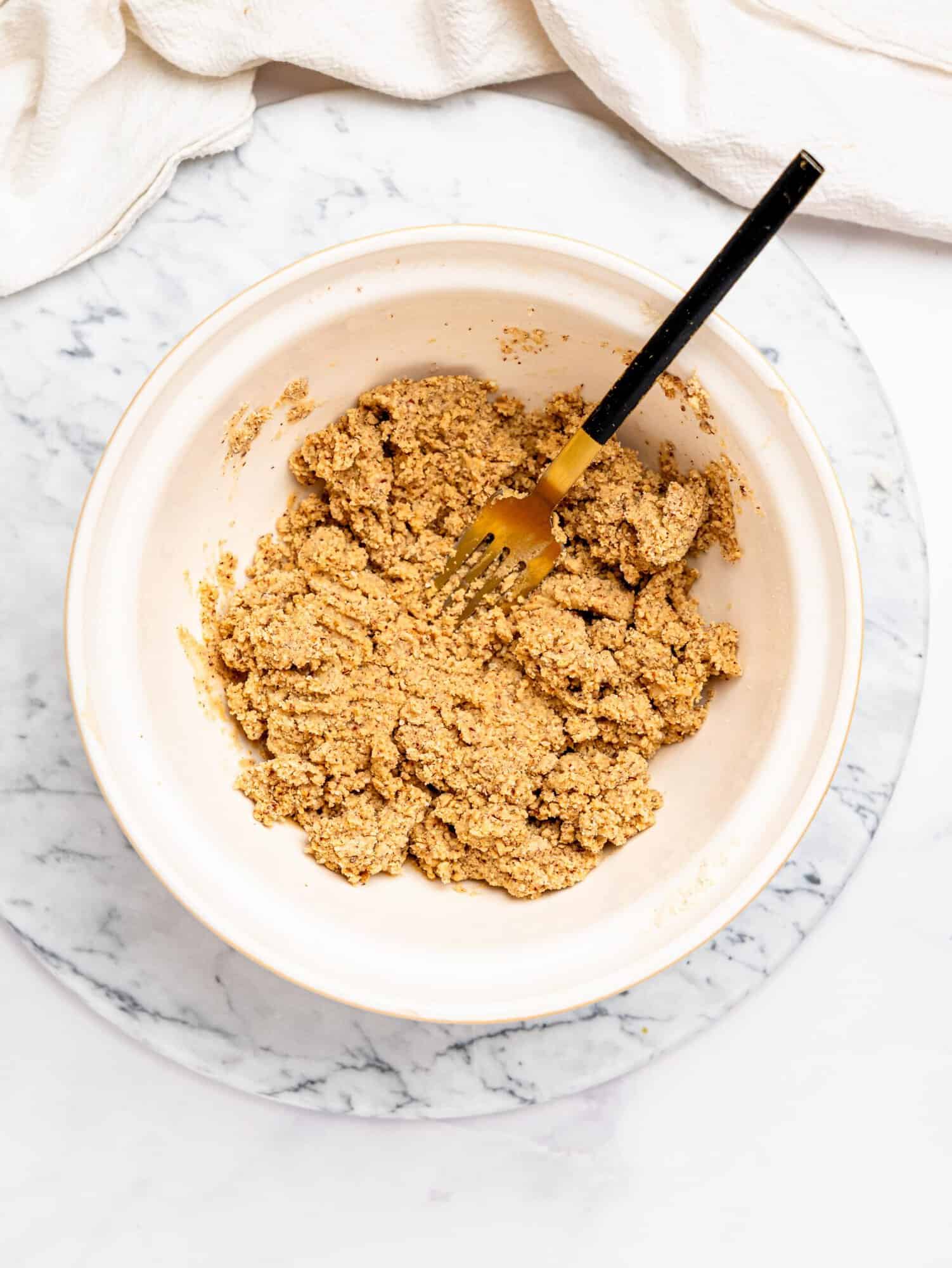 Healthy snickers base in a mixing bowl.