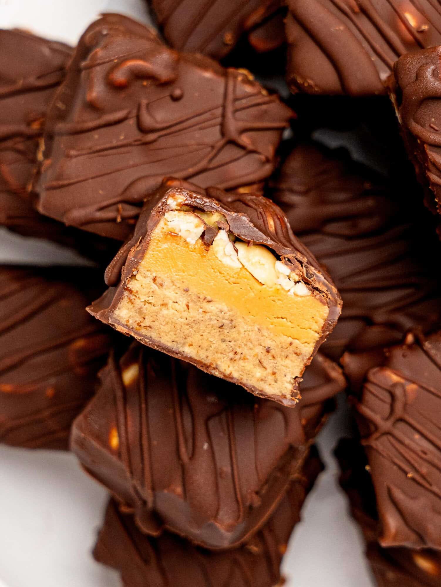 Close up view of the cross section of the protein snickers bites.