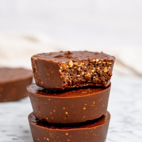 Three quinoa crunch cups stacked on top of each other.