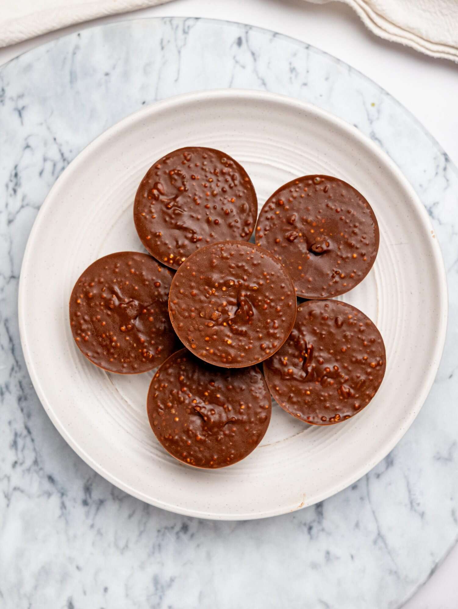 Quinoa crunch cups on a white plate.