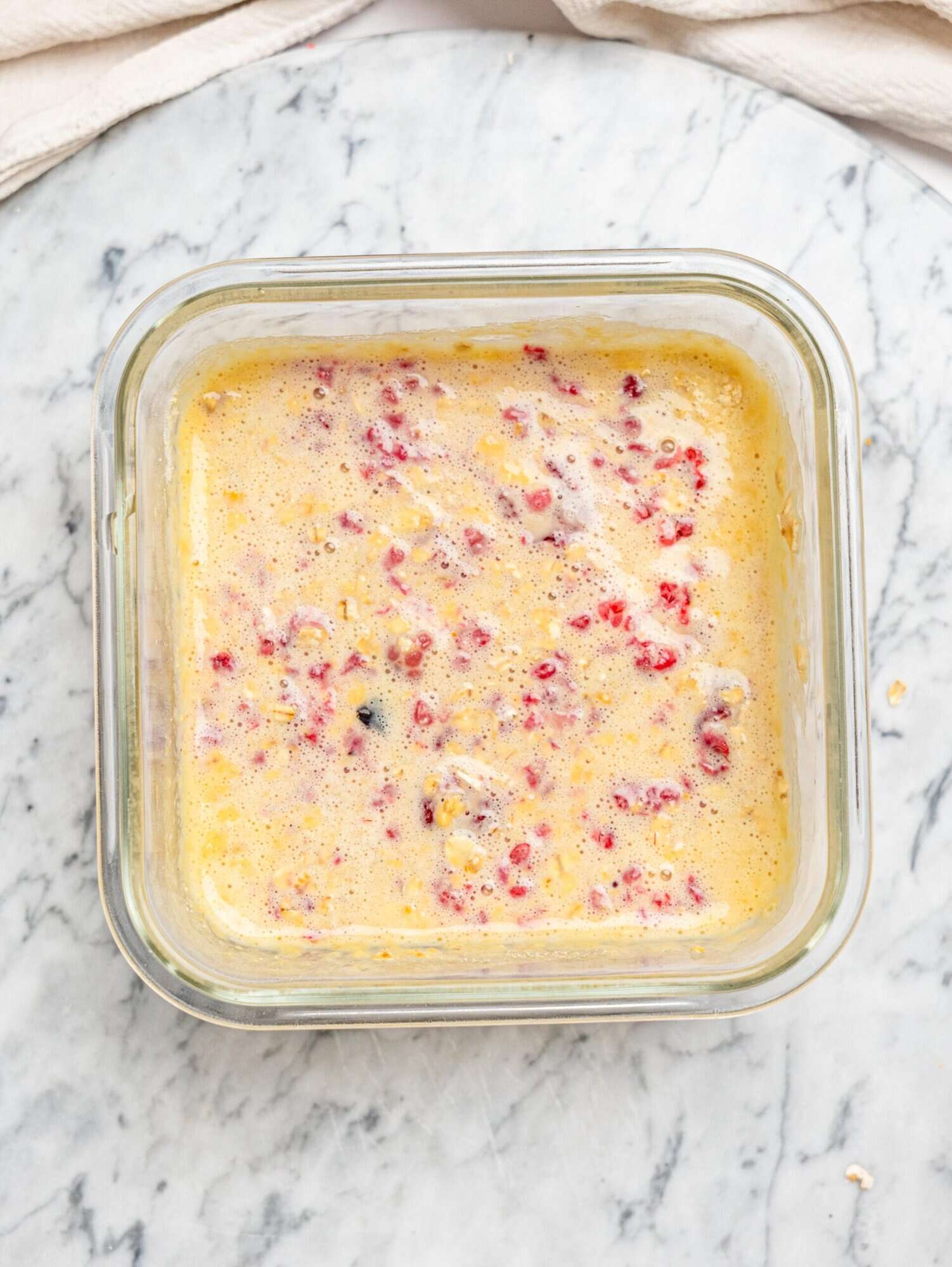 Raspberry protein baked oats mixture before baking.