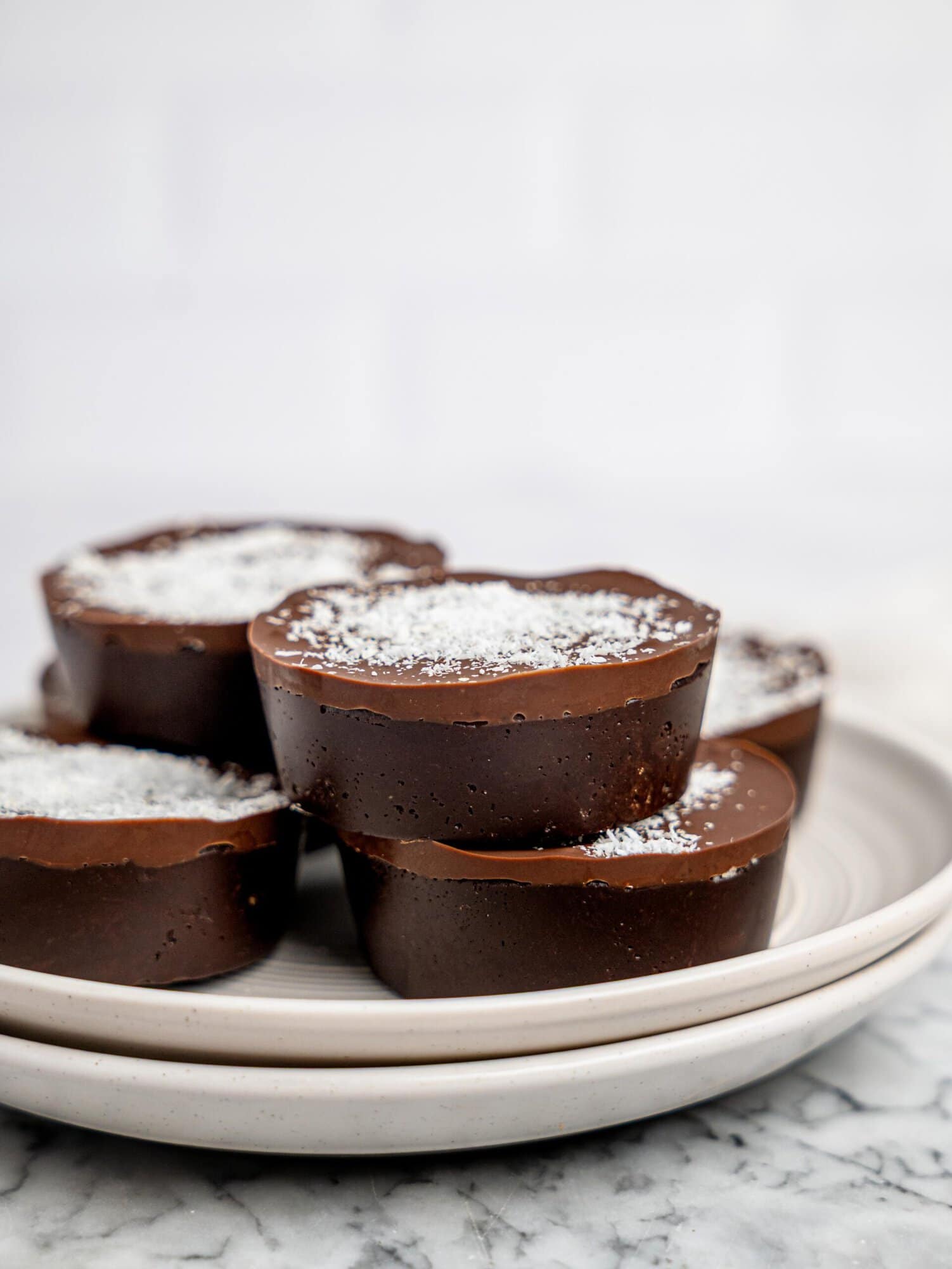 No-bake bounty brownie cups on a white plate.