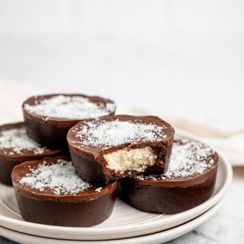 No-bake bounty brownie cups on a white plate.