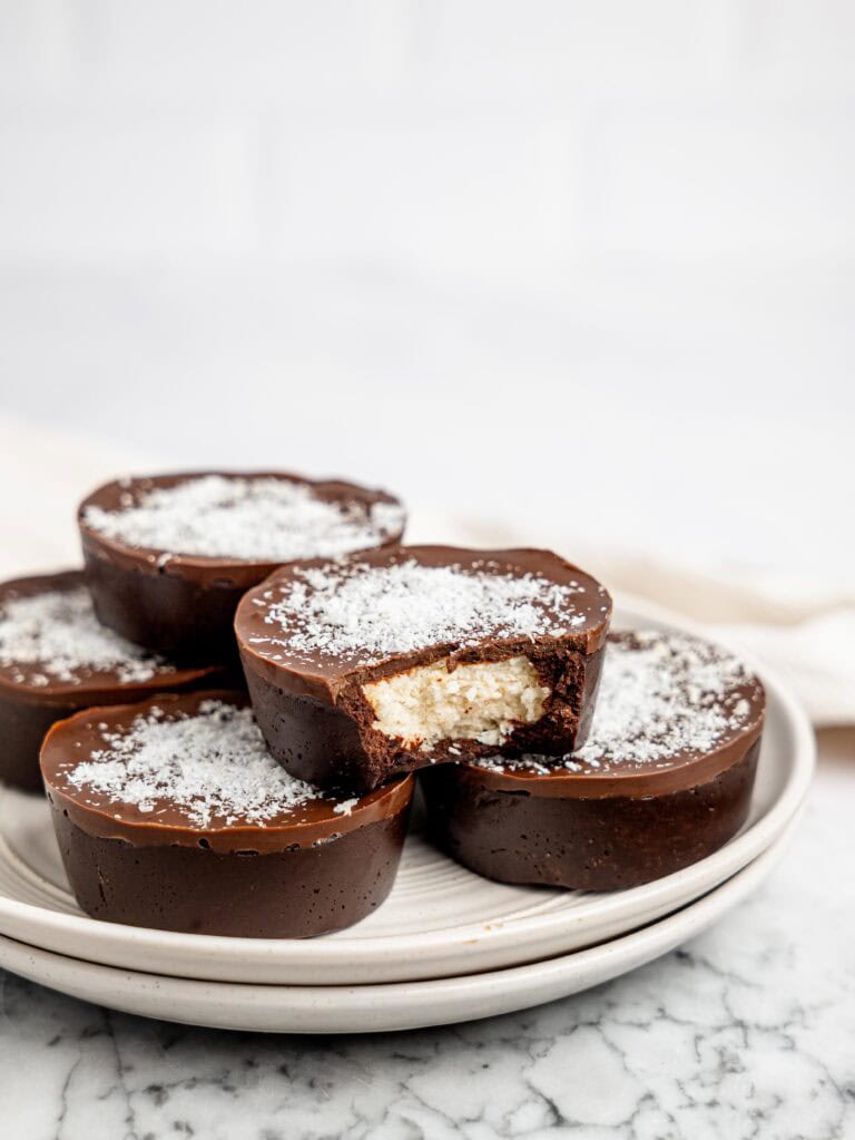 No-bake bounty brownie cups on a white plate.