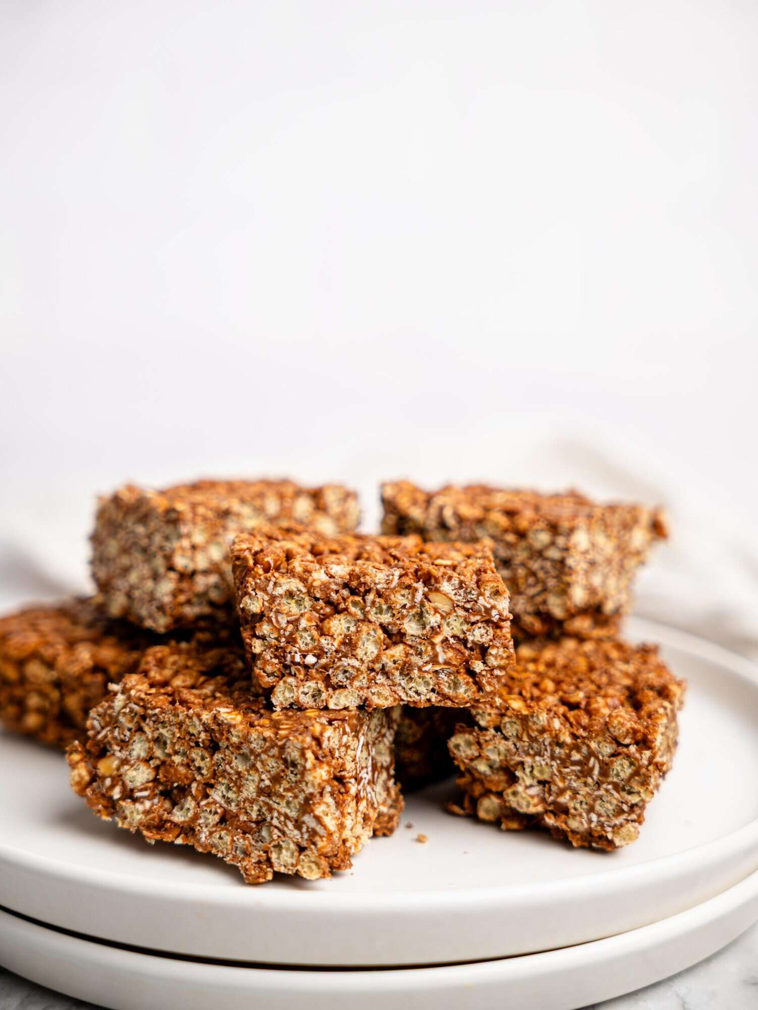 Healthy Rice Krispie Squares on a white plate.