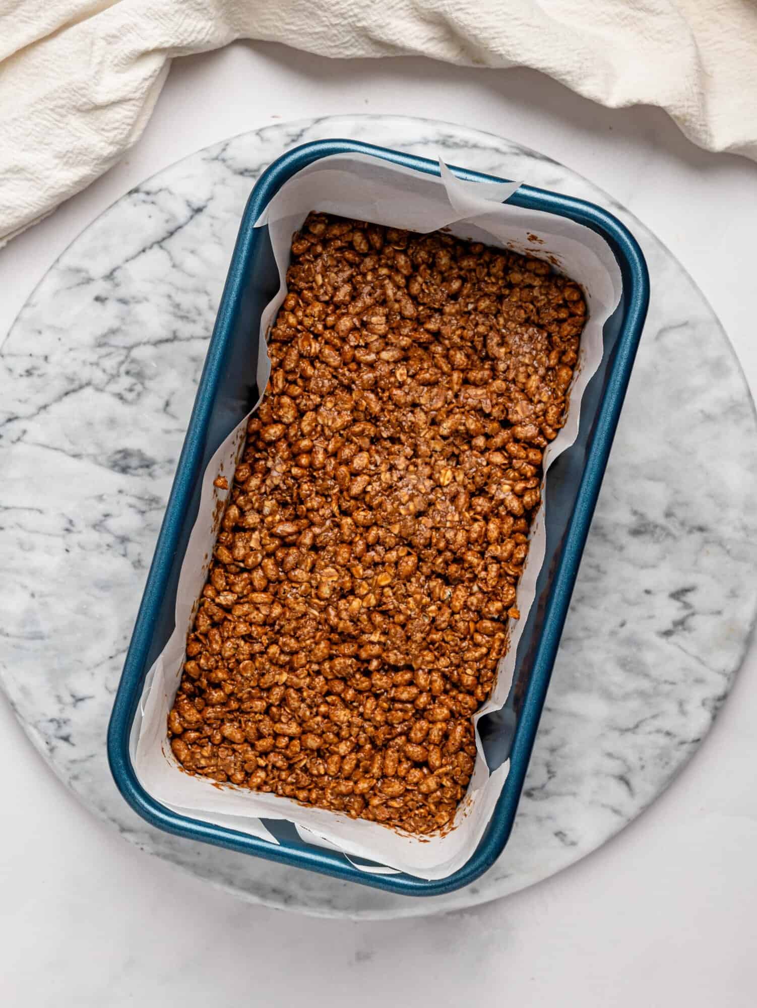 Healthy Rice Krispie Squares pressed into a loaf pan.
