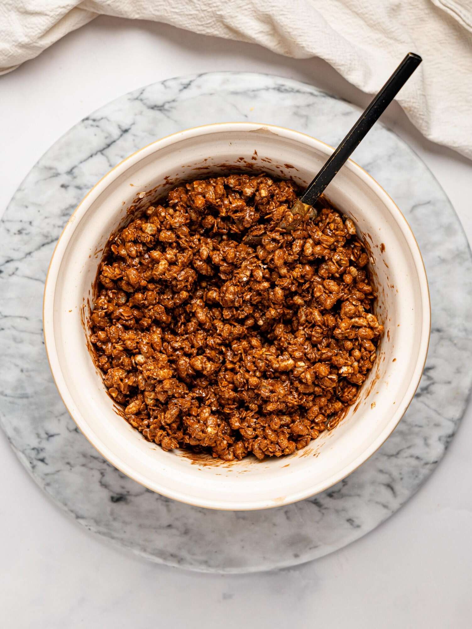 Healthy Rice Krispie Squares mixture in a mixing bowl.