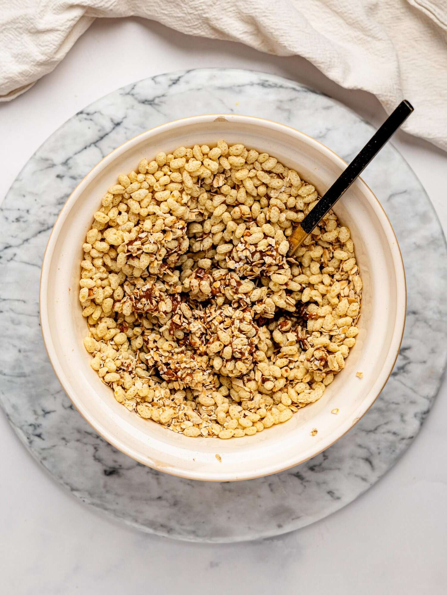 Healthy Rice Krispie Squares ingredients in a mixing bowl.