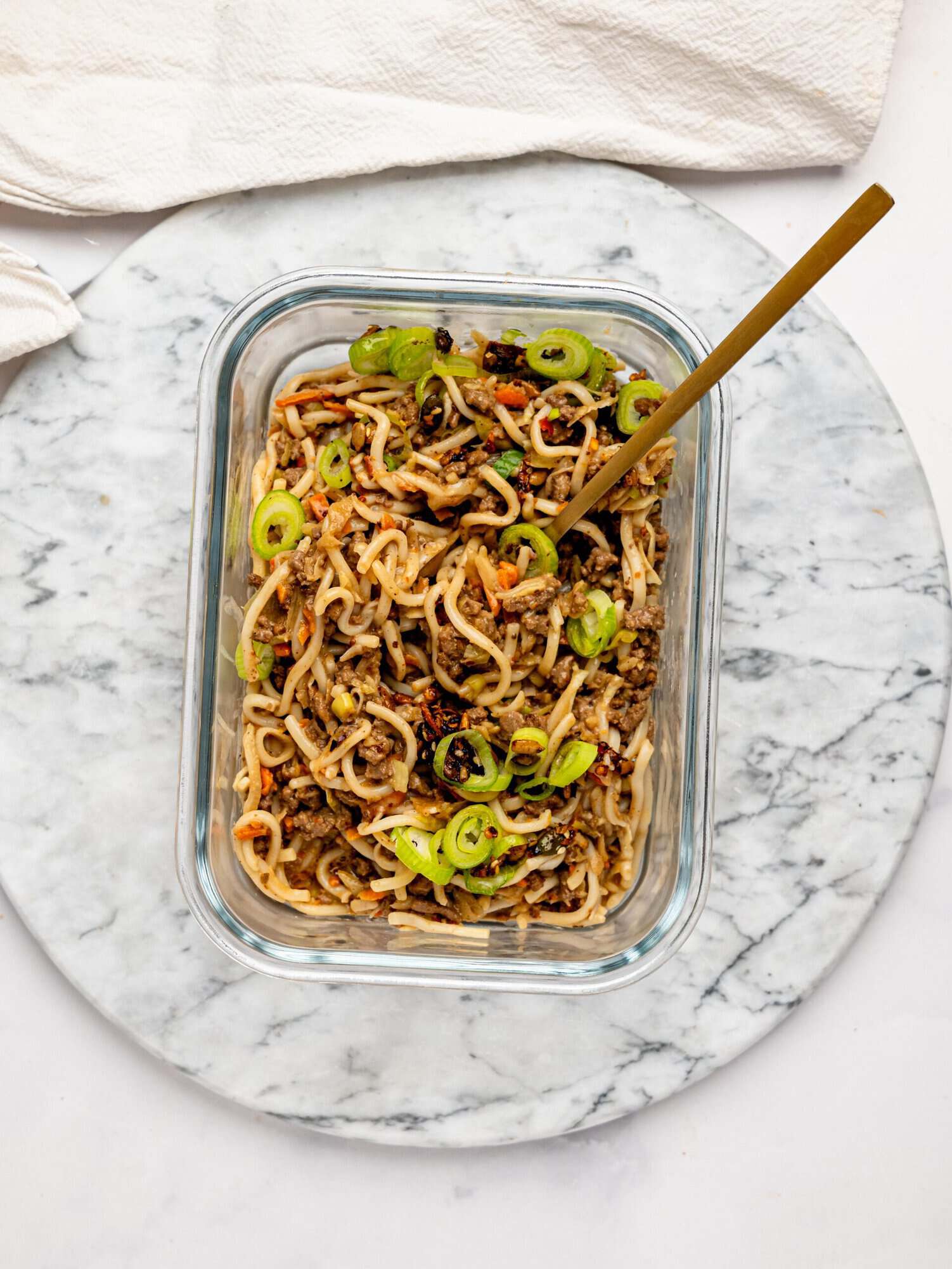 Ramen noodles with ground beef in a meal-prep container.