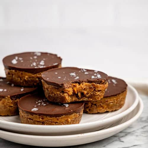 Millionaires' Weetbix Cups stacked on a white plate.