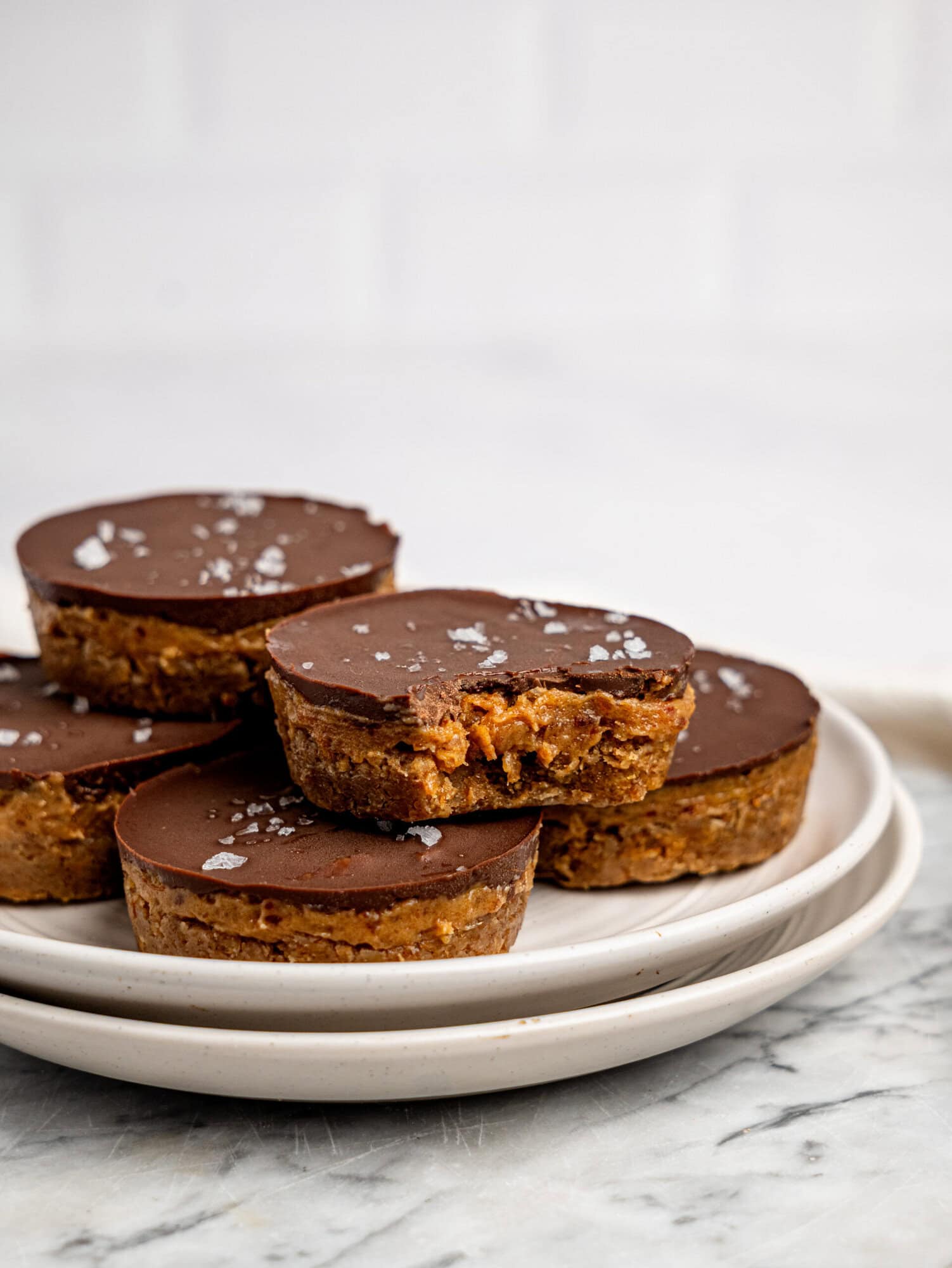 Millionaires' Weetbix Cups stacked on a white plate.