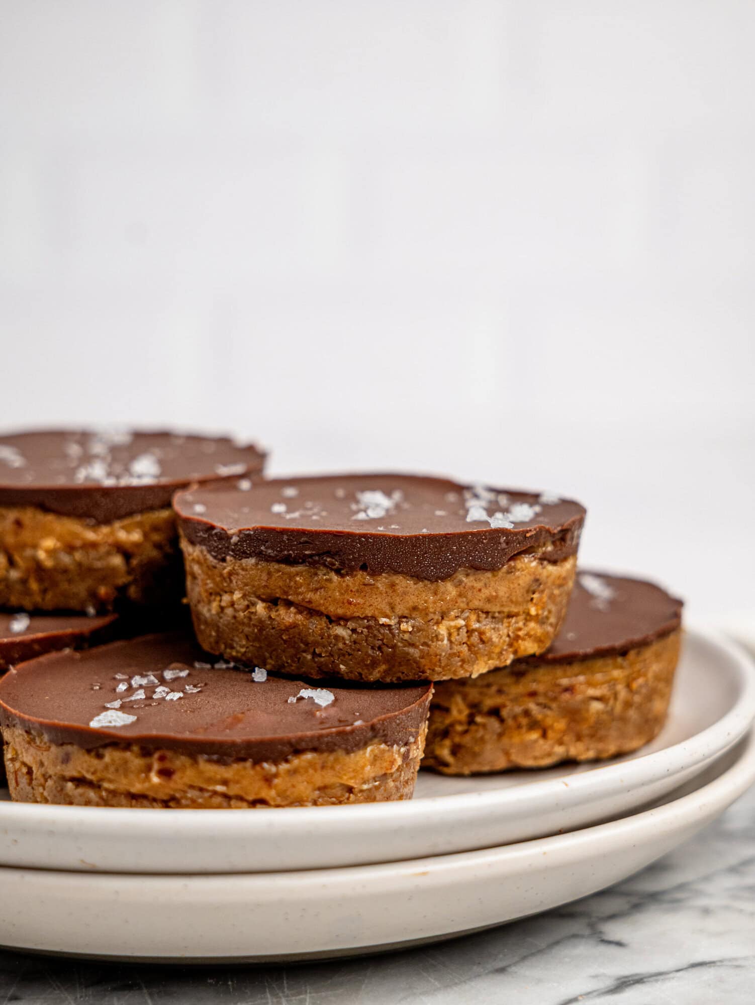 Millionaires' Weetbix Cups stacked on a white plate.