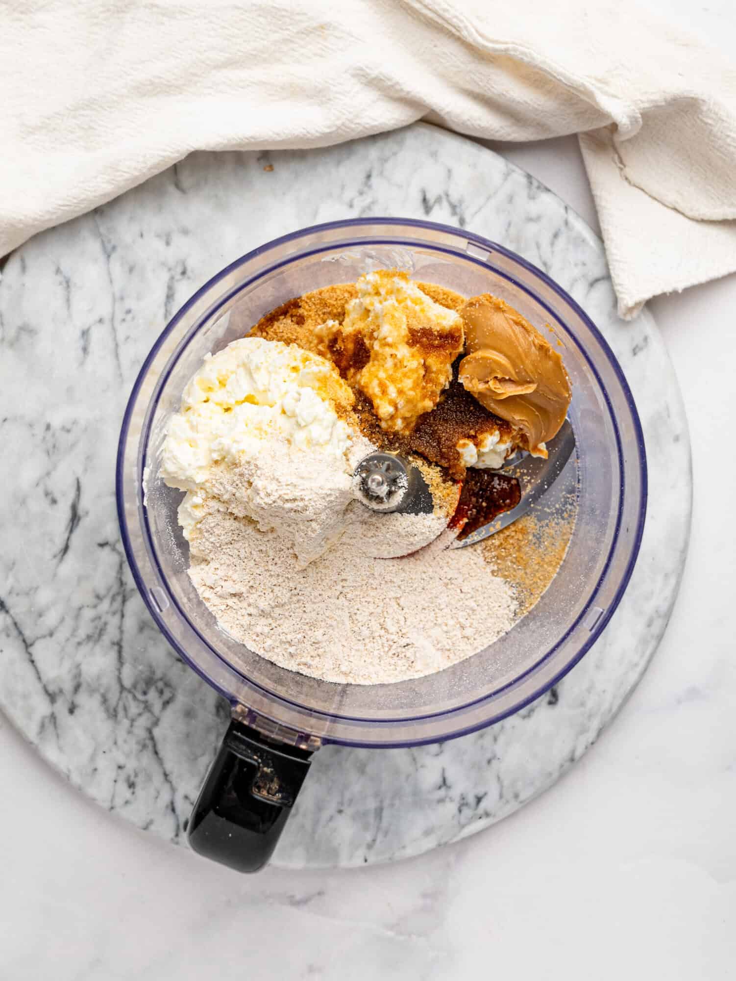 Cookie dough mousse ingredients blended together in a food processor until smooth and creamy.