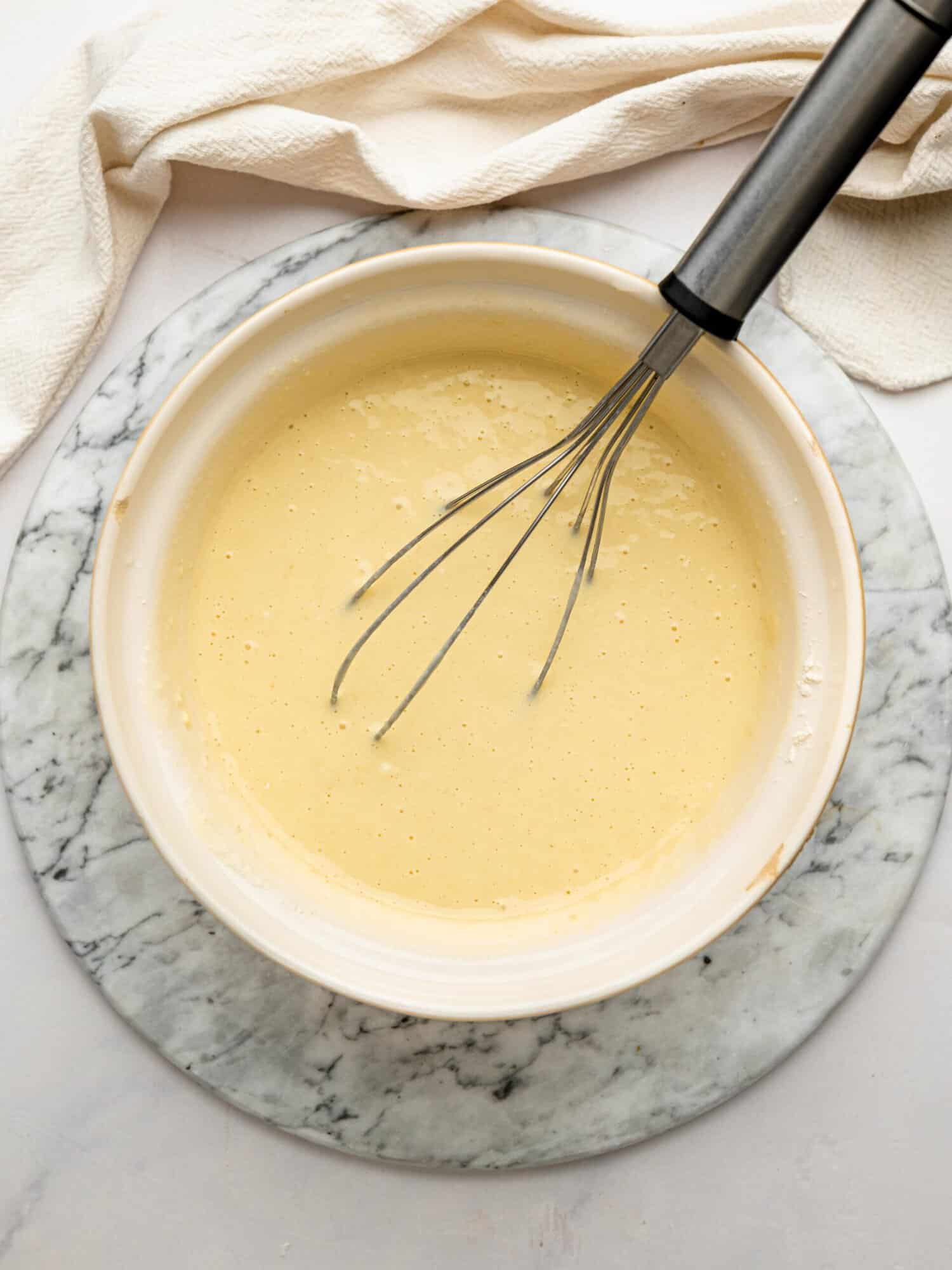 Smooth one bowl gluten free waffle batter ready to rest before cooking.