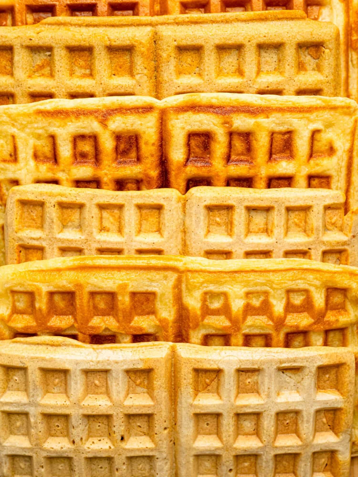 Stack of homemade gluten-free waffles made with a one bowl gluten free waffle recipe.