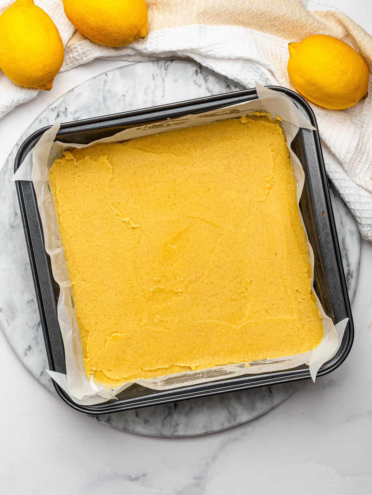 Shortbread crust for gluten free lemon bars before baking..
