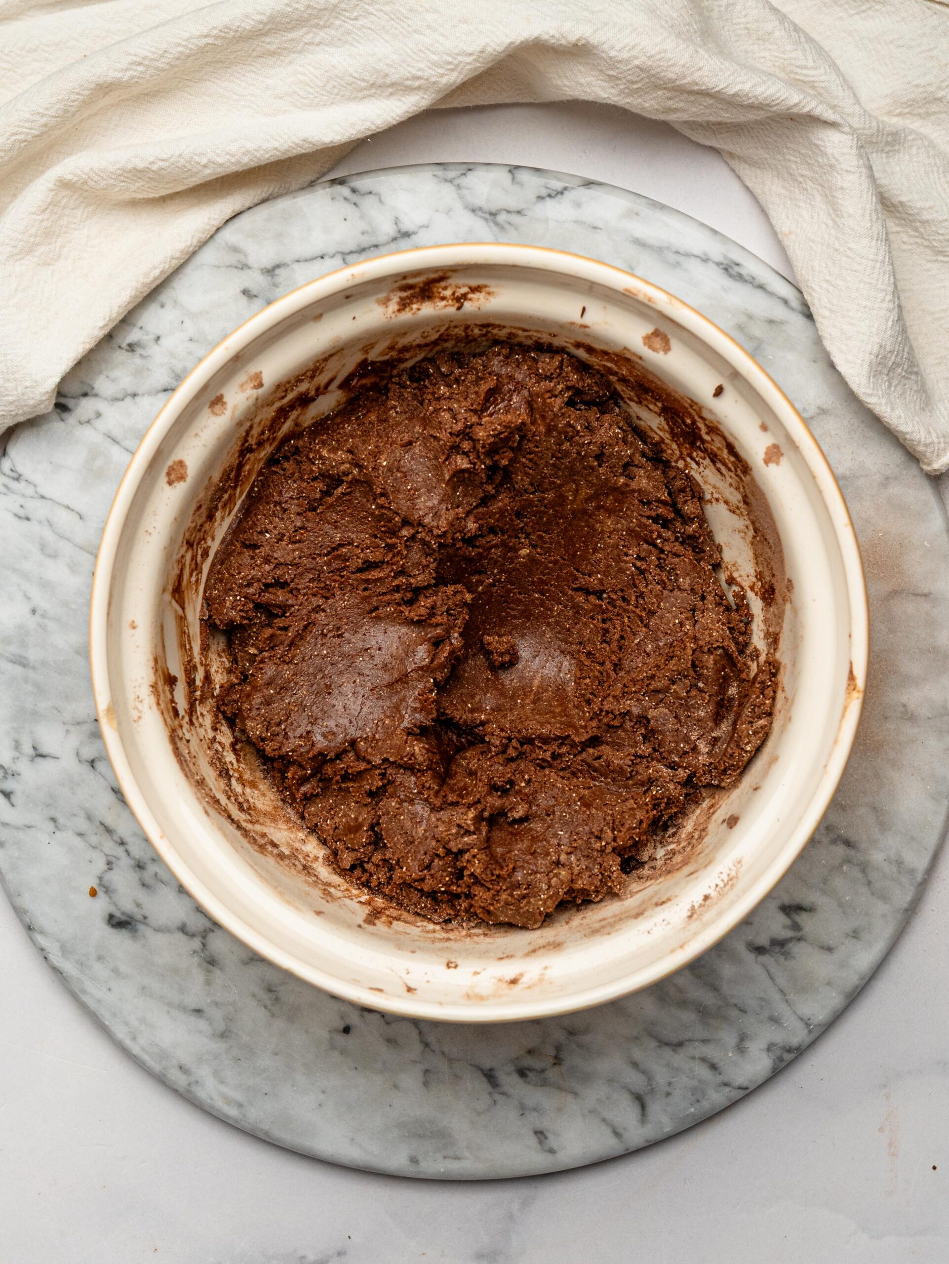 Thick chocolate protein bar mixture after combining the wet and dry ingredients.
