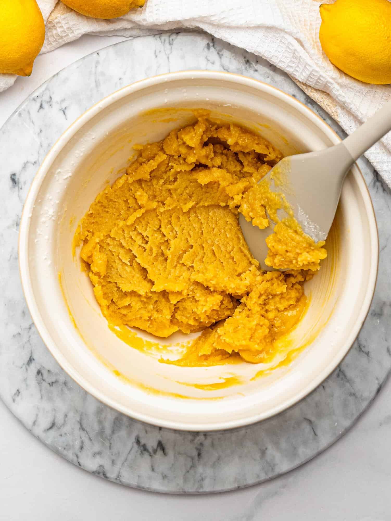 Gluten free shortbread crust dough mixed in a bowl.