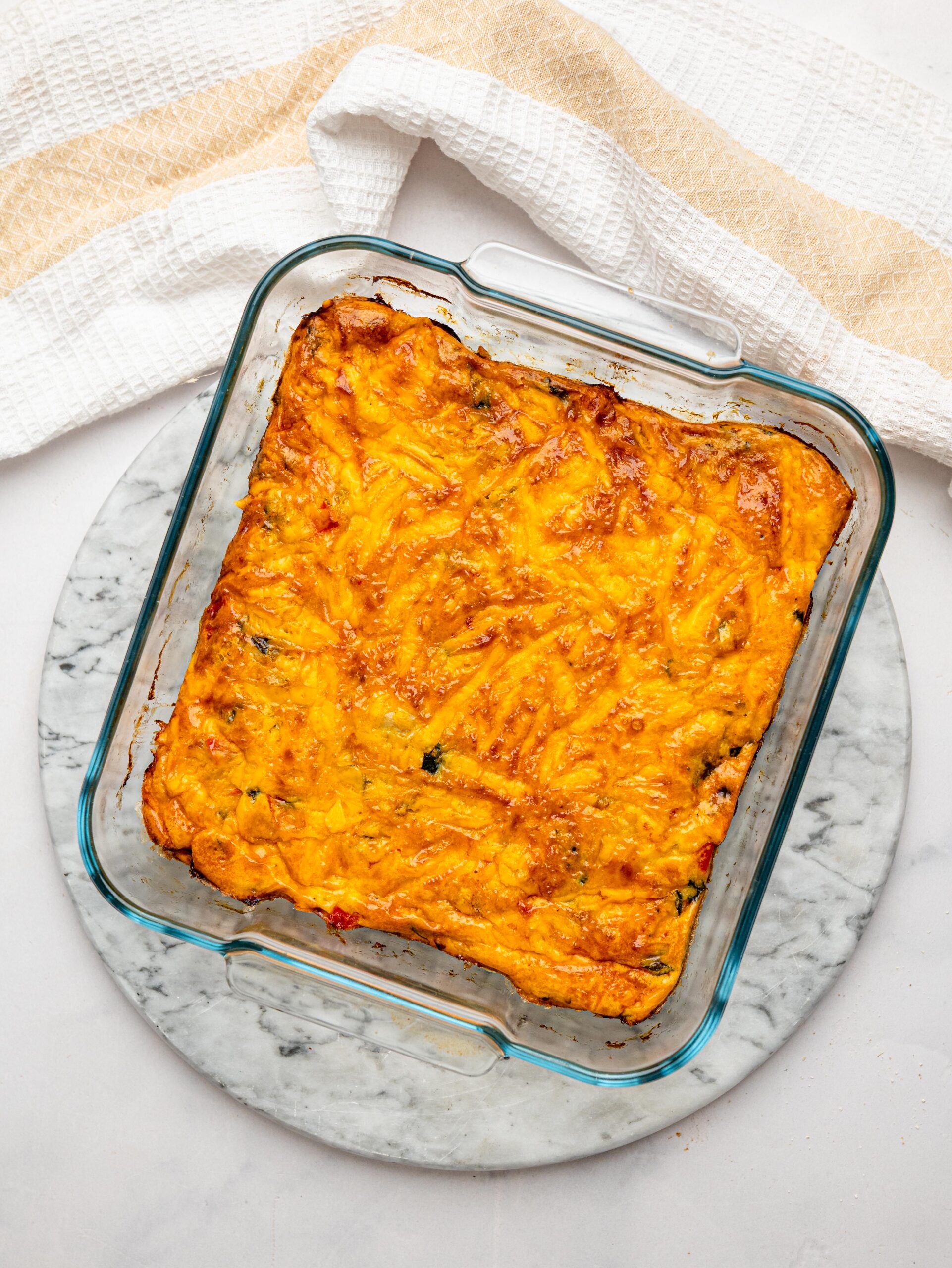 Baked high protein egg bake with a golden cheddar cheese topping.