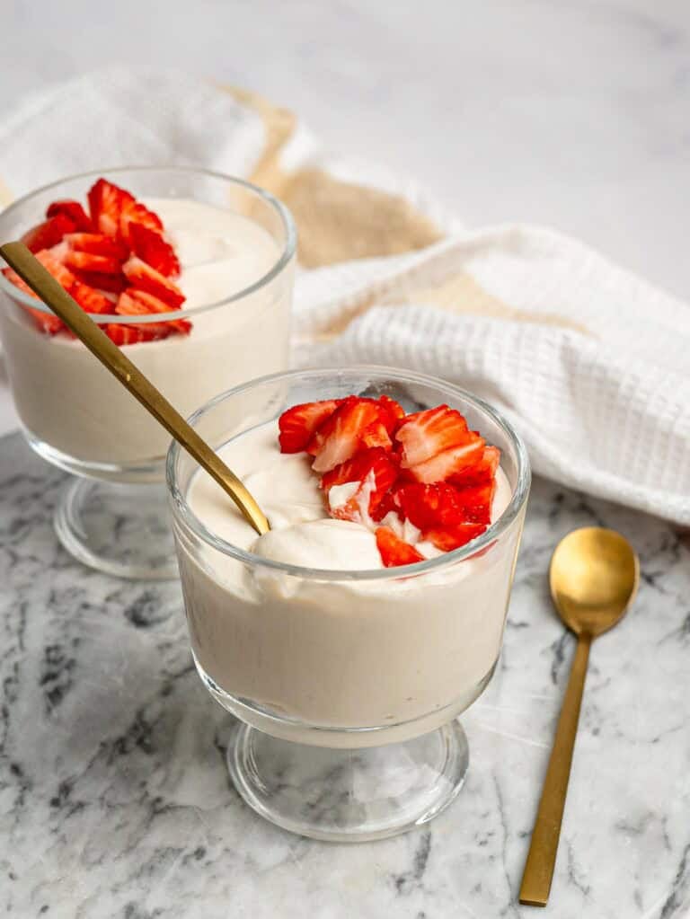 Creamy protein pudding topped with chopped fresh strawberries.