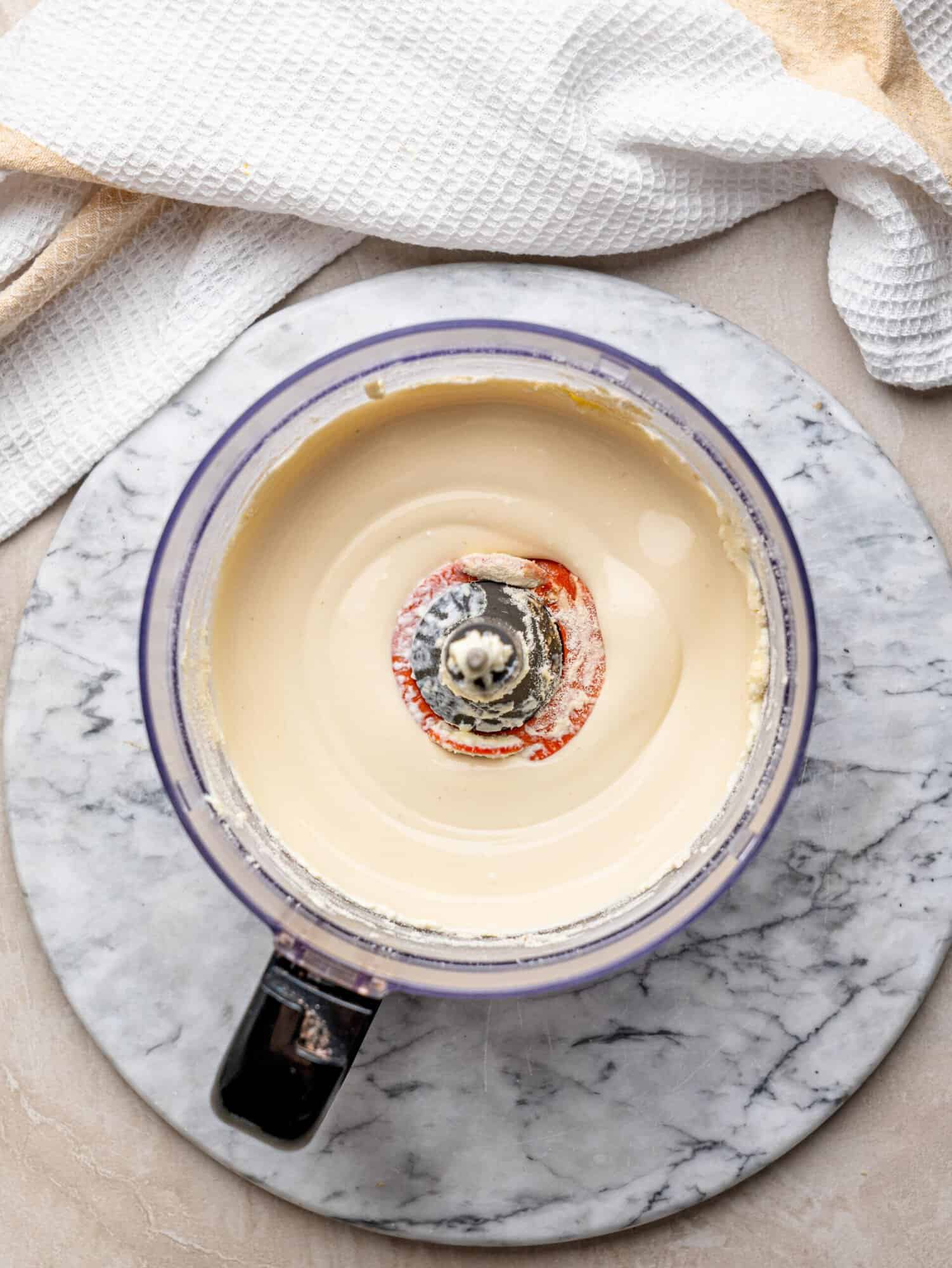 Smooth cottage cheese ice cream base blended in a food processor.