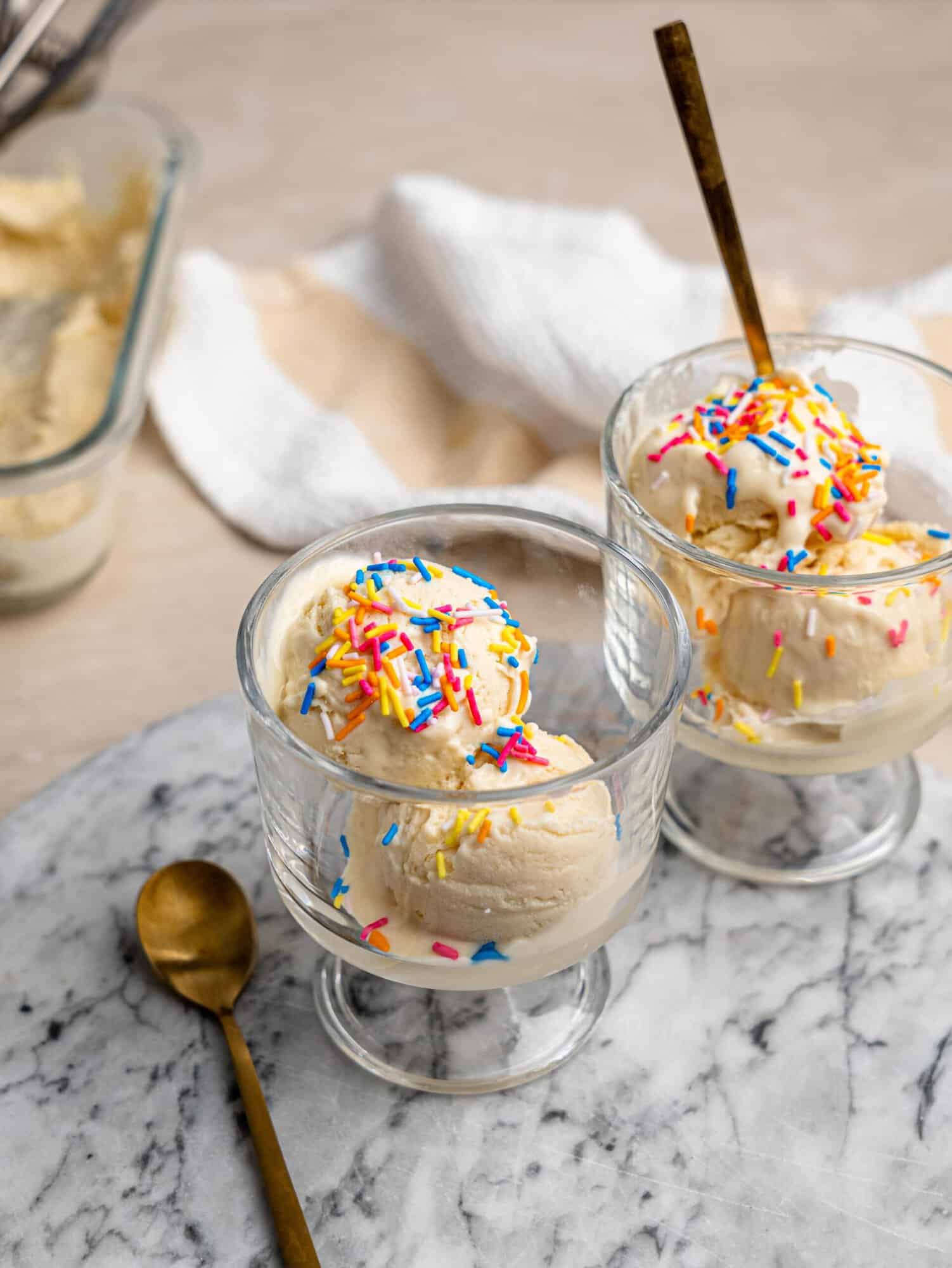 Two servings of creamy high protein ice cream topped with colorful sprinkles.